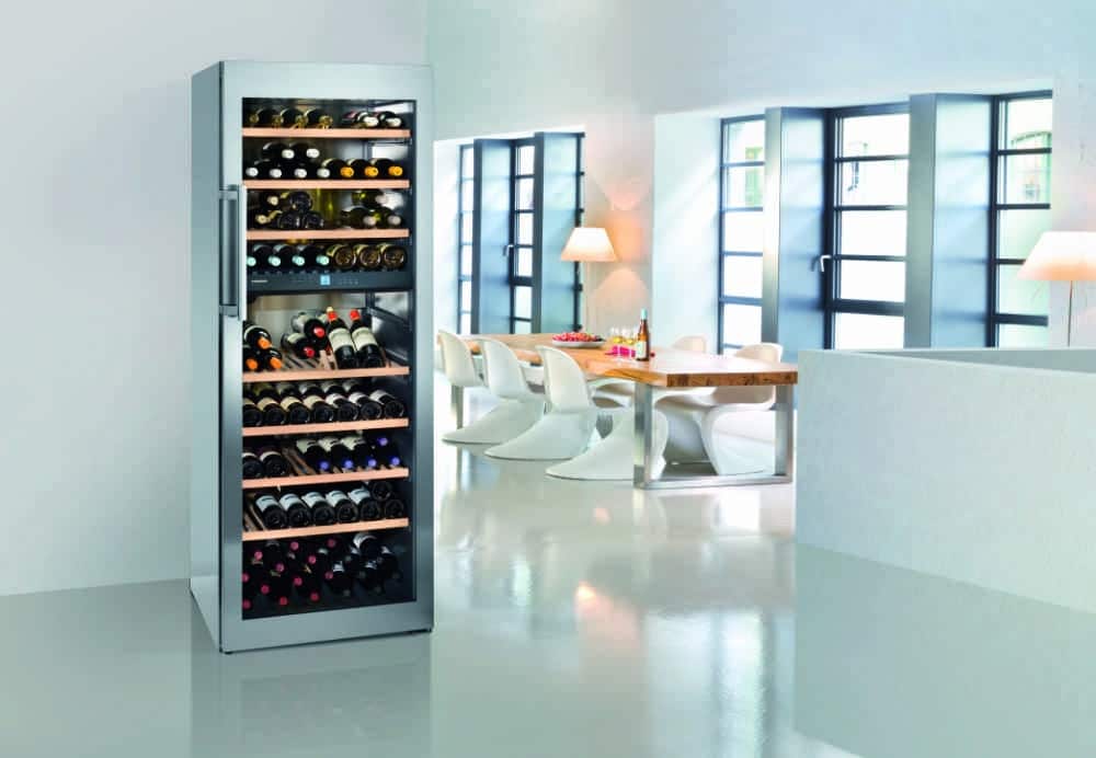 A wine fridge in a room

Description automatically generated